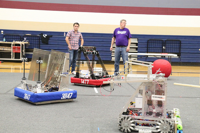 All three robots in the middle of practice. 