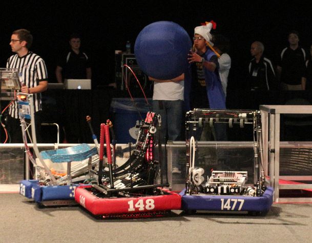 Torque fights past FRC 148, the Robowranglers, for the ball.